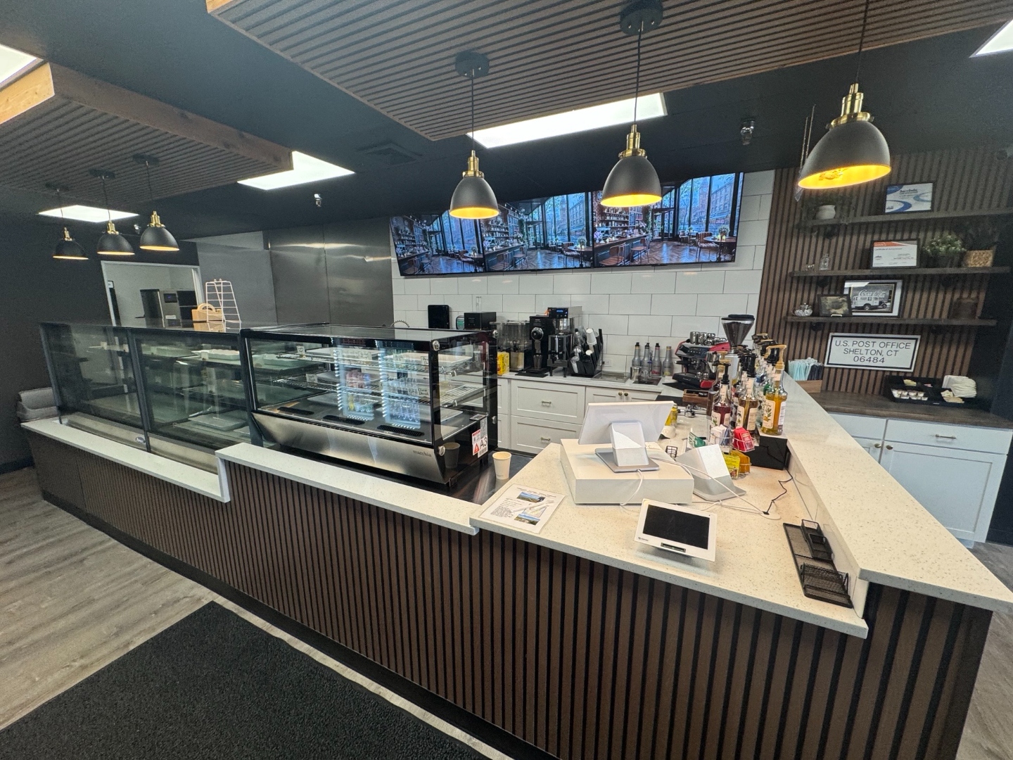 White Hills Coffee & Deli counter with espresso equipment and display cases