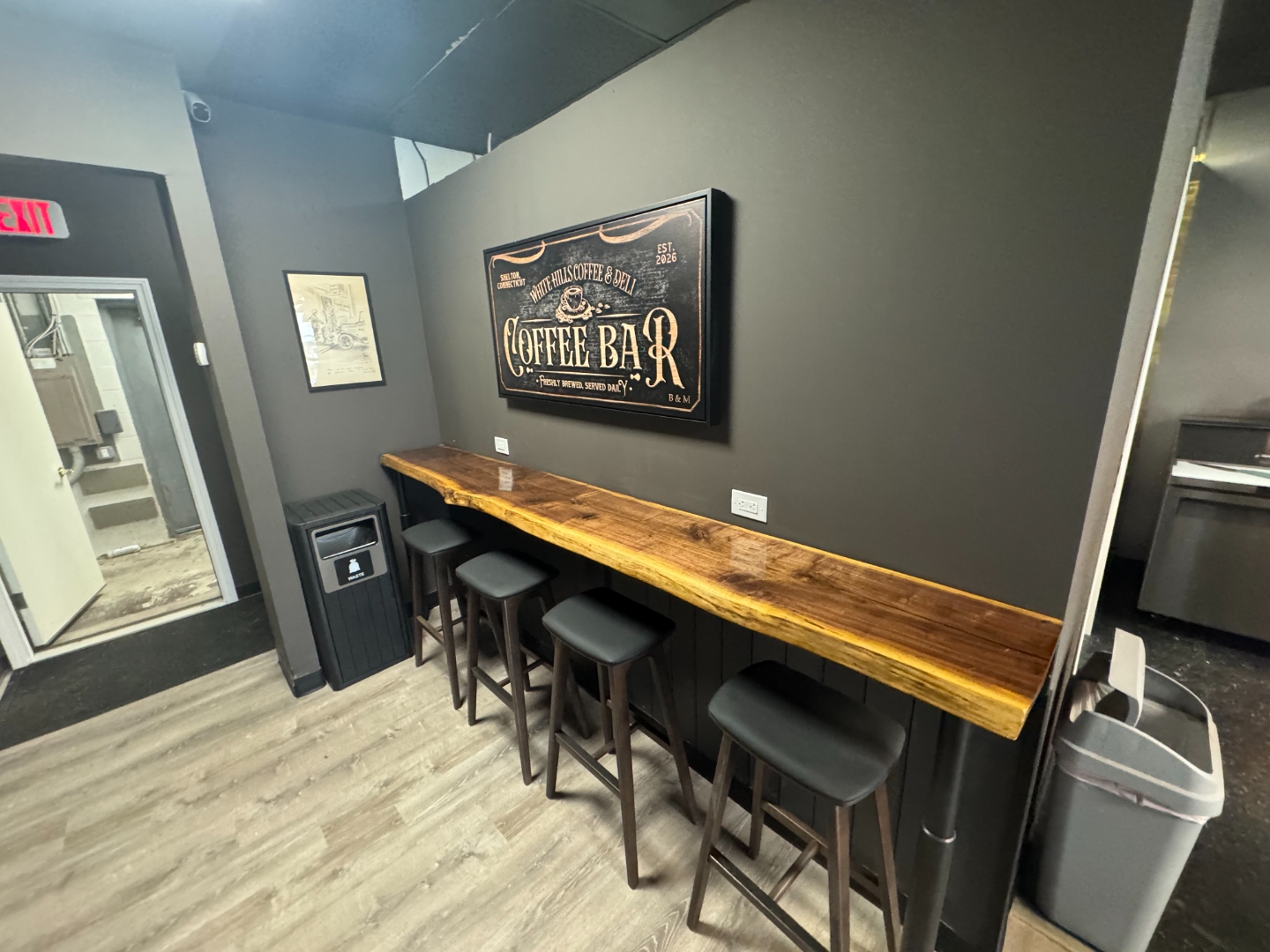 White Hills Coffee Bar seating area with live-edge wood bar