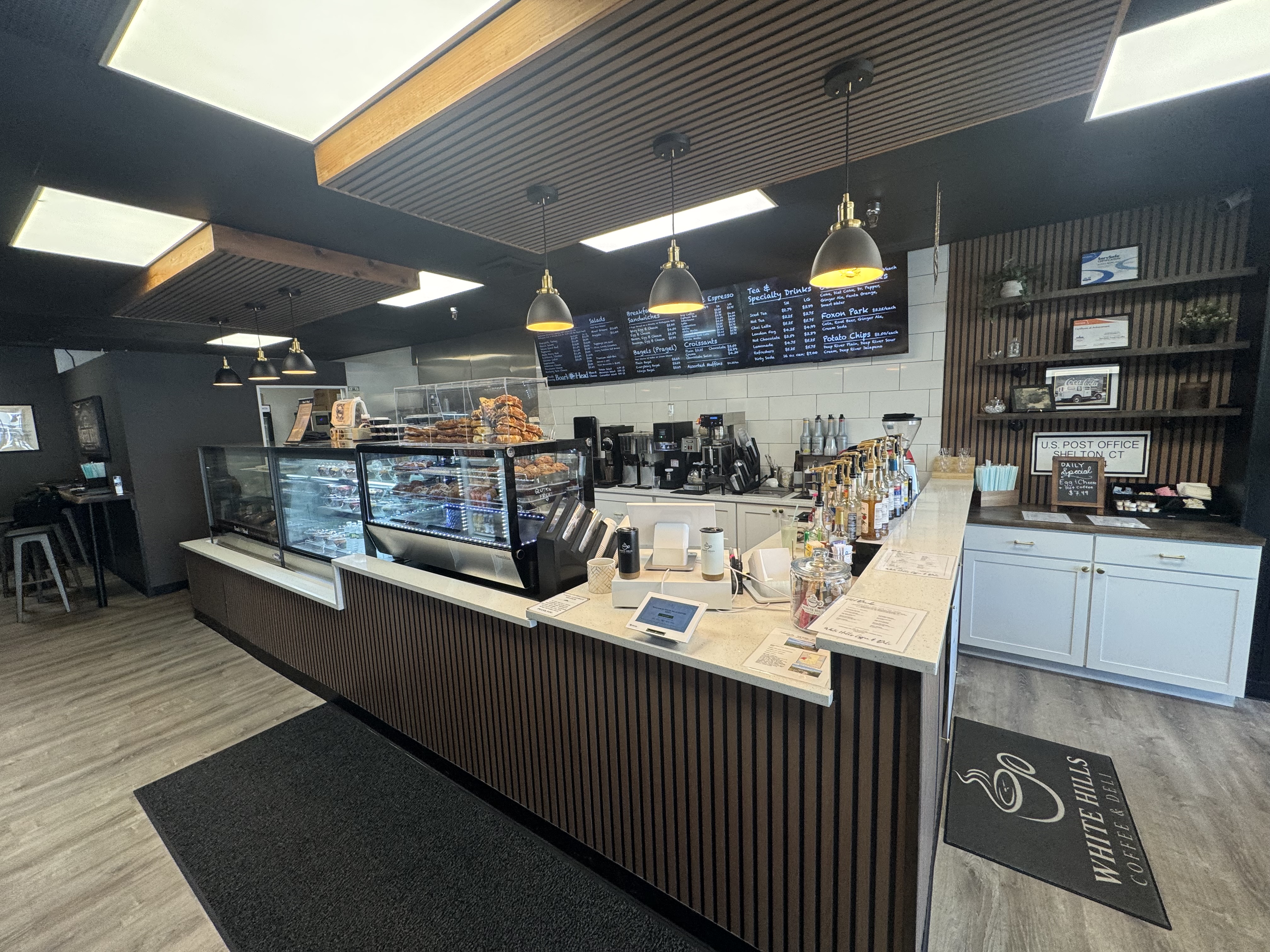 White Hills Coffee & Deli counter with deli case and menu boards