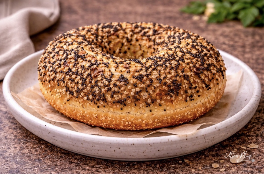 Everything bagel on a plate with parchment